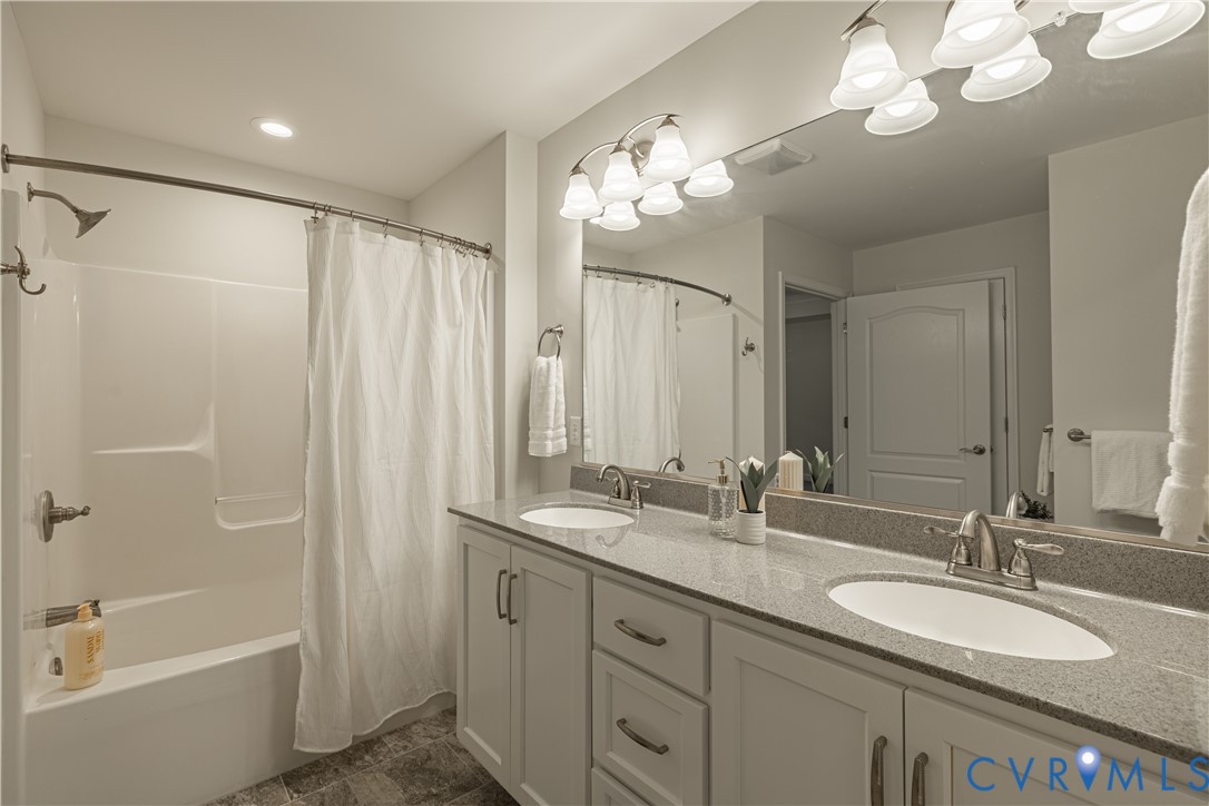 6720 Claiborne Road Sutherland, VA 23885 - Photo 22 of 35 Double vanity with granite-style countertops, whit