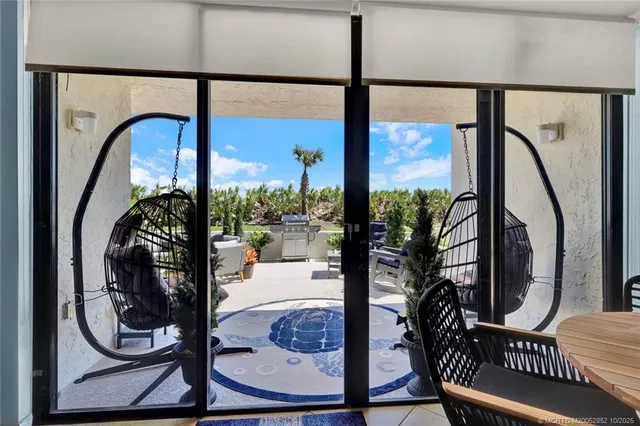 a front view of a building with a yard