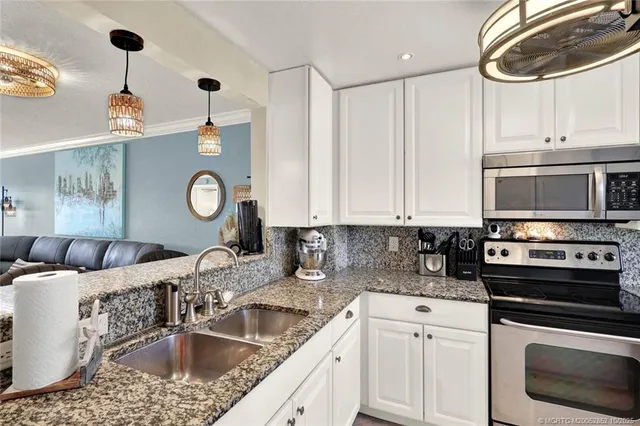 a dining room with furniture a rug and a window
