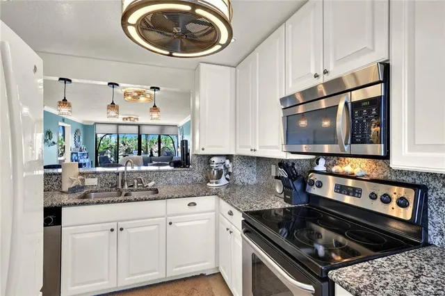 a bedroom with a large bed and a large window