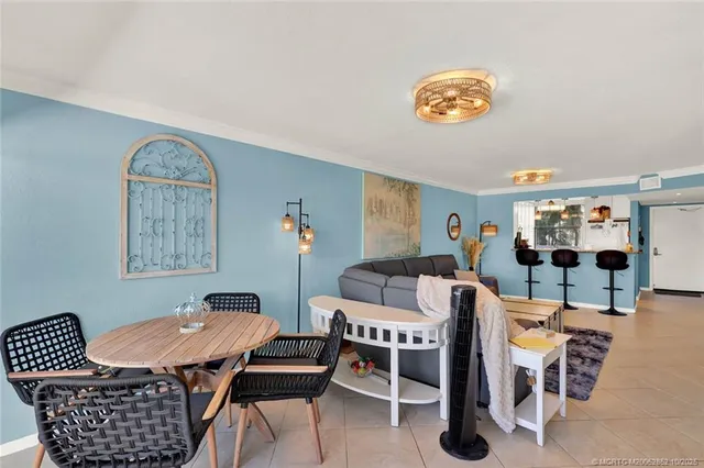 a bedroom with a bed and painting on the wall