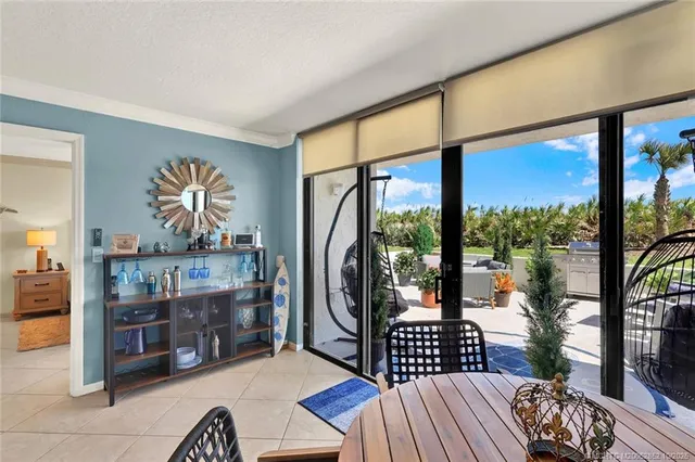 a front view of a house with a porch and glass windows