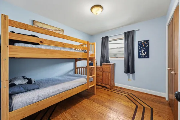 a bedroom with bed and a window