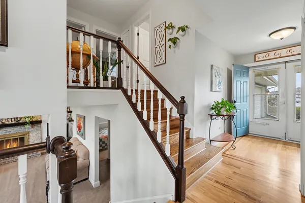 a view of a livingroom with furniture and staircase
