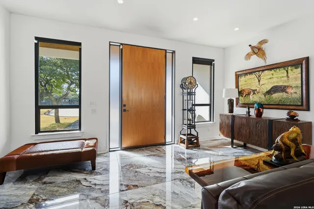 a bedroom with furniture and a flat screen tv