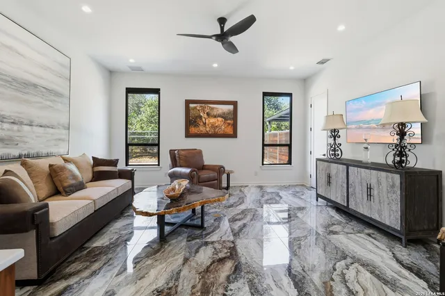 a living room with furniture and a window