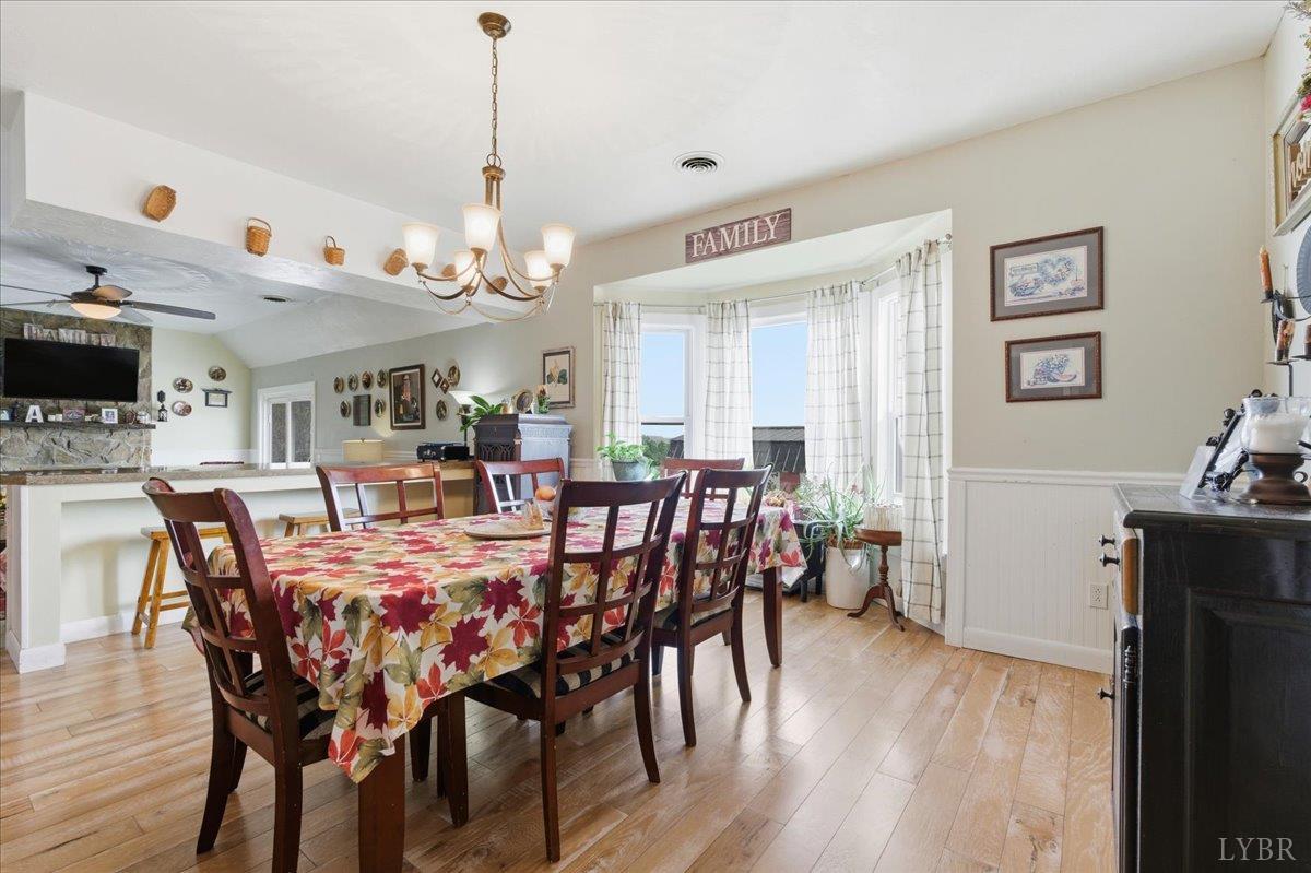 1618 Quaker Church Road Bedford, VA 24523 - Photo 15 of 50 a view of a dining room with furniture and wooden floor