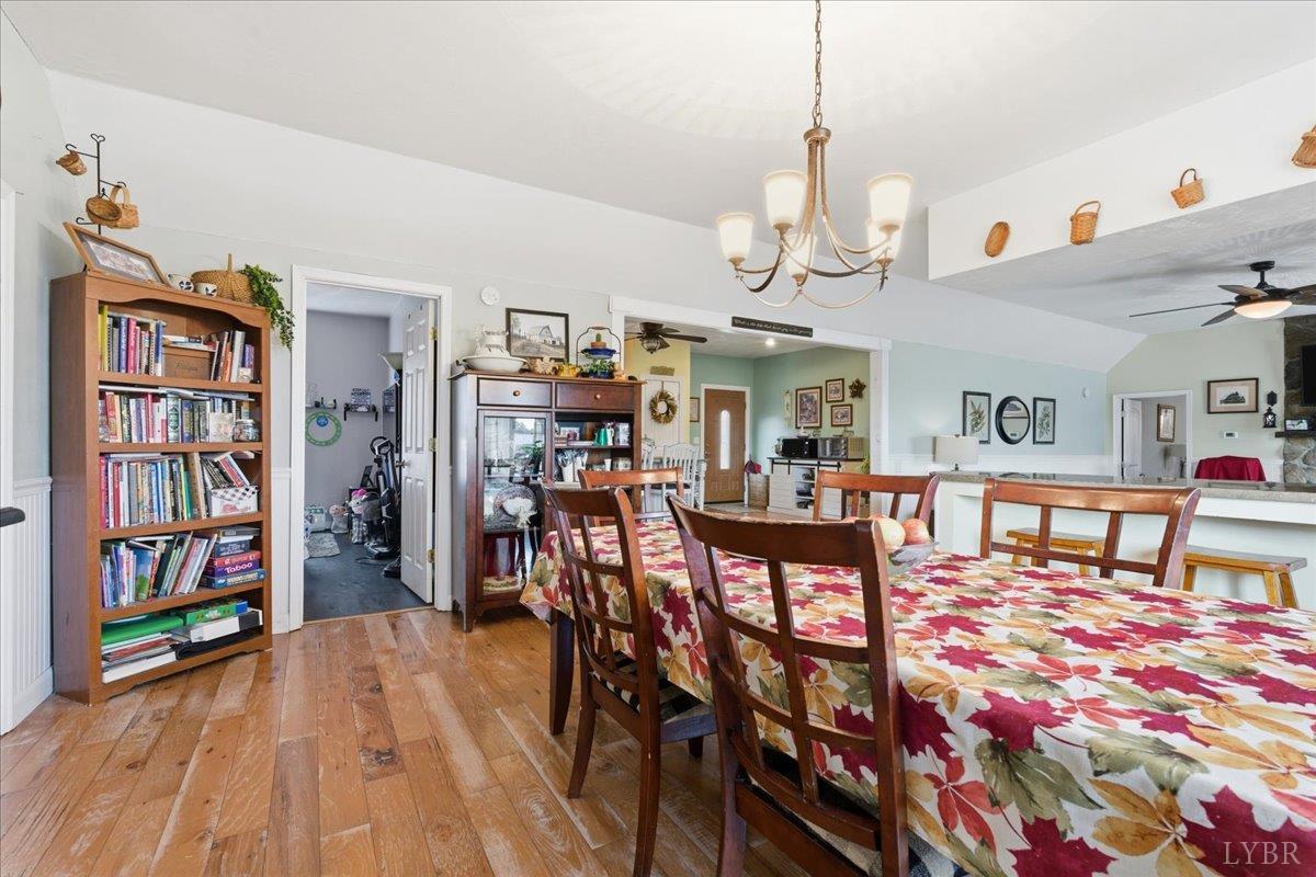 1618 Quaker Church Road Bedford, VA 24523 - Photo 16 of 50 a view of a dining room with furniture and wooden floor