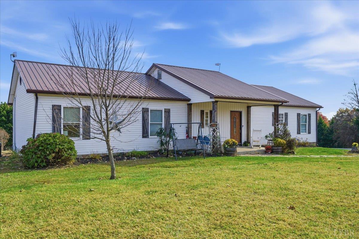 1618 Quaker Church Road Bedford, VA 24523 - Photo 2 of 50 a front view of a house with a garden