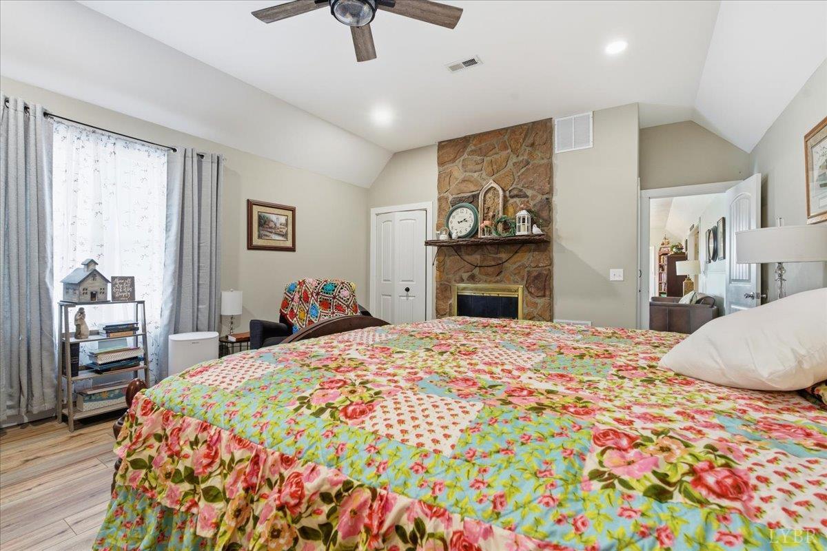 1618 Quaker Church Road Bedford, VA 24523 - Photo 24 of 50 a bedroom with a bed and wooden floor