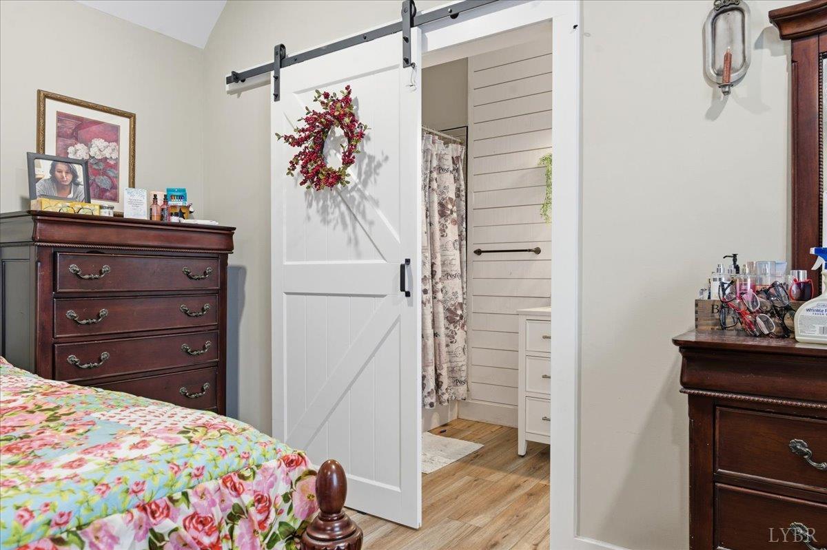 1618 Quaker Church Road Bedford, VA 24523 - Photo 27 of 50 a bedroom with a bed and a mirror on the dresser