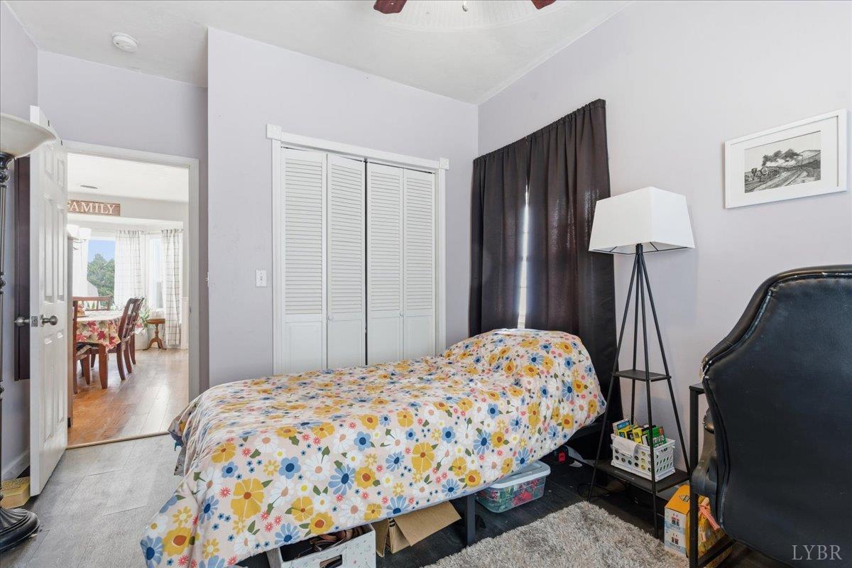 1618 Quaker Church Road Bedford, VA 24523 - Photo 29 of 50 a bedroom with a bed and a chandelier