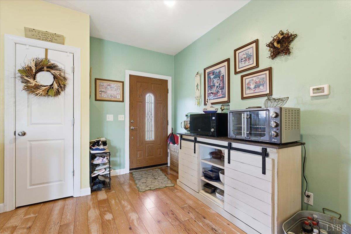 1618 Quaker Church Road Bedford, VA 24523 - Photo 30 of 50 a view of a workspace with furniture and wooden floor