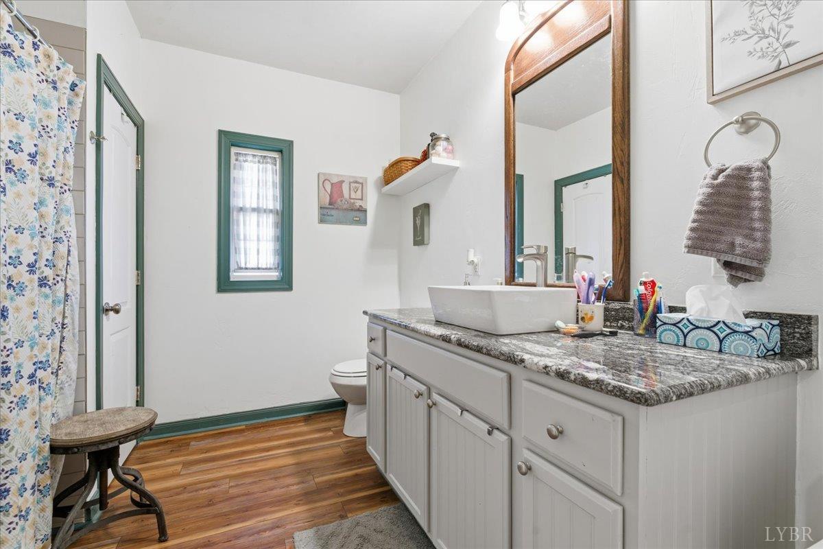 1618 Quaker Church Road Bedford, VA 24523 - Photo 31 of 50 a bathroom with a sink and a mirror