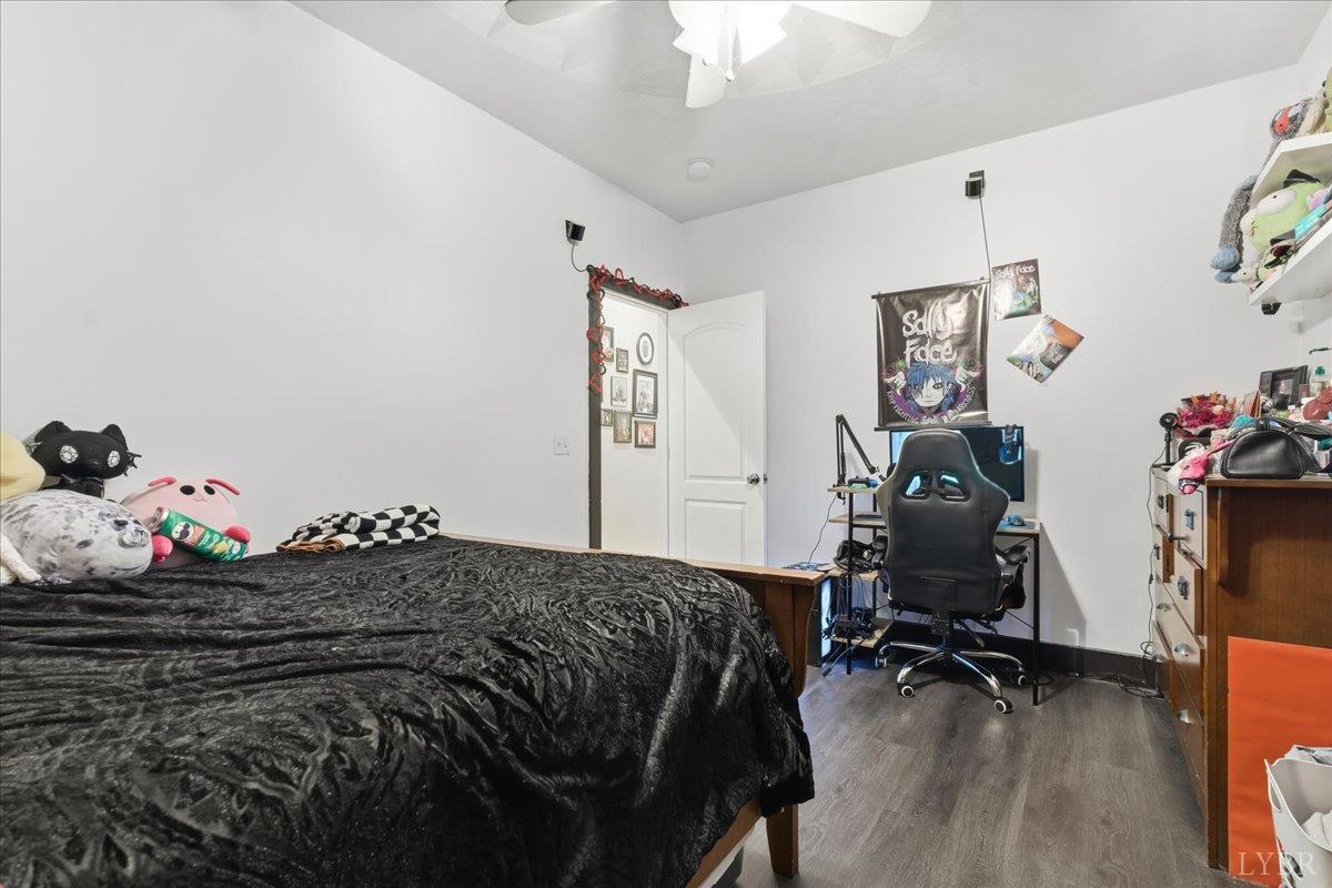 1618 Quaker Church Road Bedford, VA 24523 - Photo 36 of 50 a bedroom with a bed and wooden floor