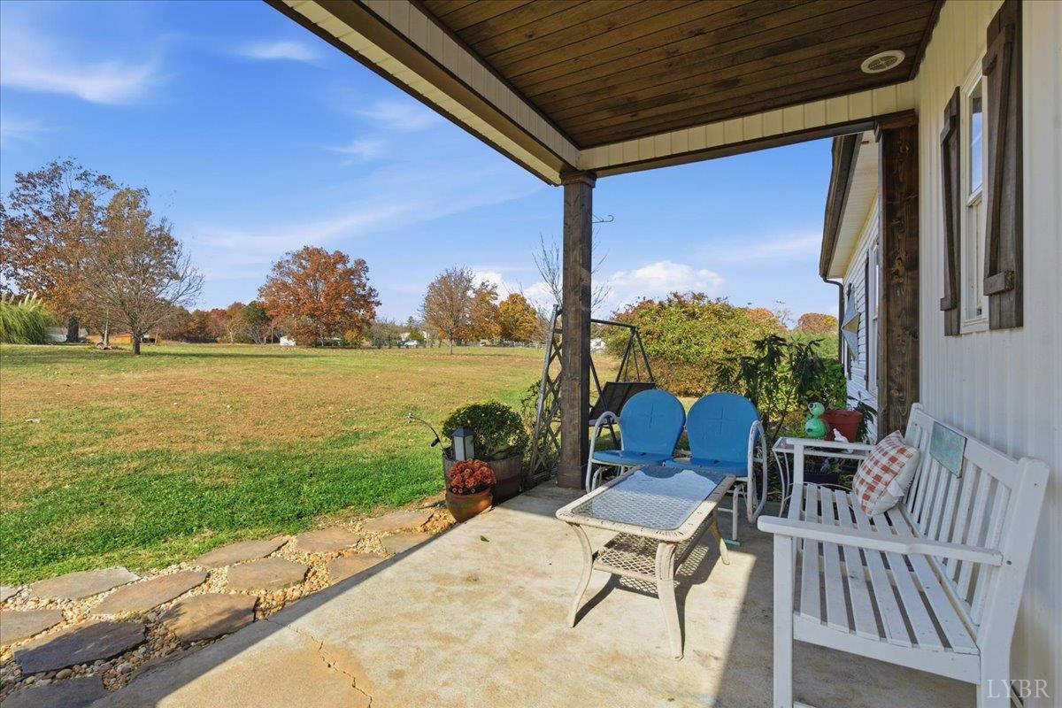 1618 Quaker Church Road Bedford, VA 24523 - Photo 37 of 50 a view of a chair and table on the terrace