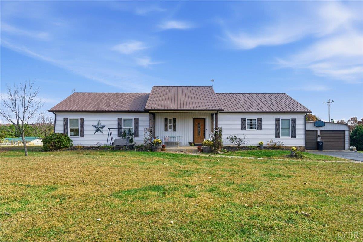 1618 Quaker Church Road Bedford, VA 24523 - Photo 4 of 50 a front view of a house with a garden