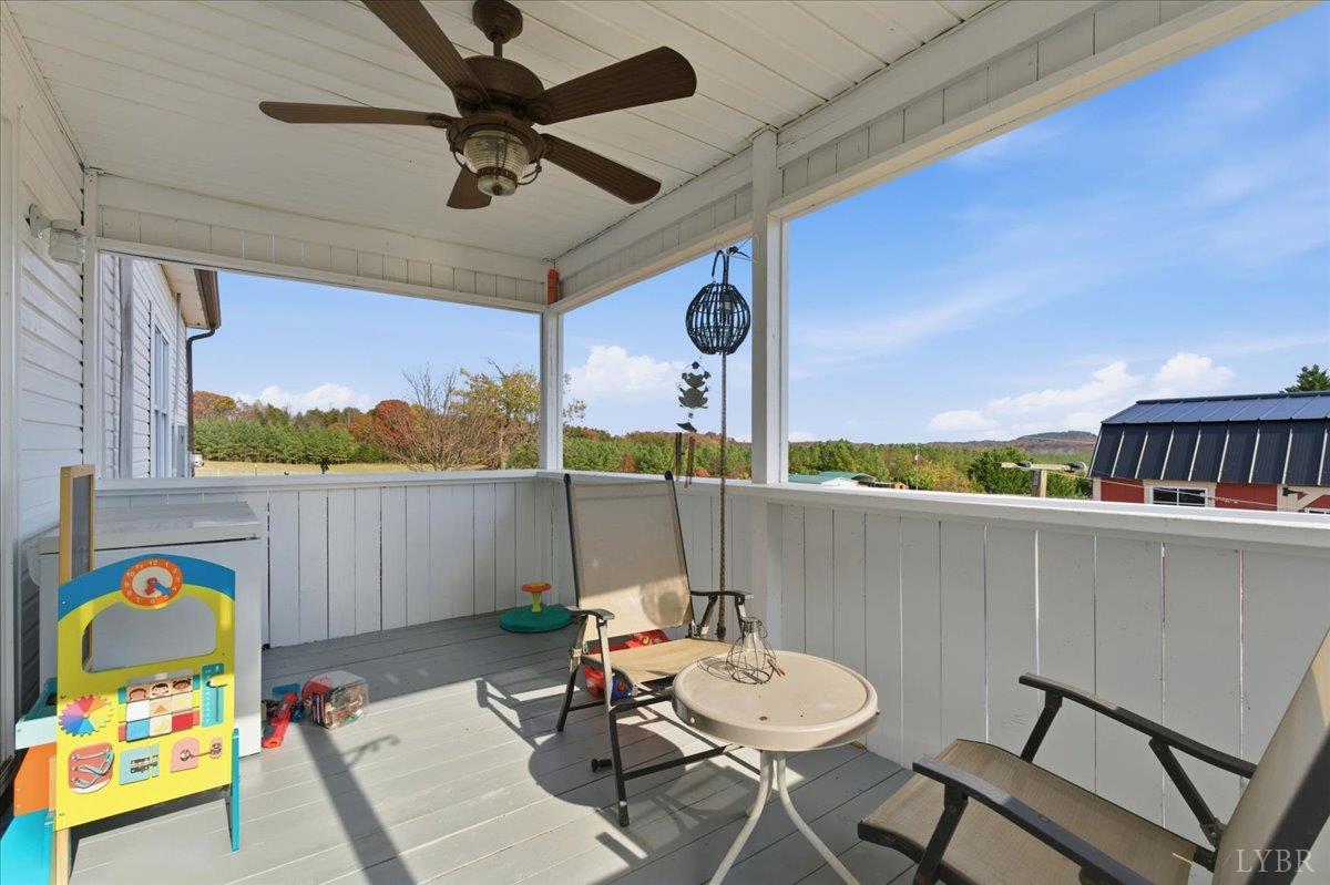 1618 Quaker Church Road Bedford, VA 24523 - Photo 43 of 50 a table and chairs in a balcony