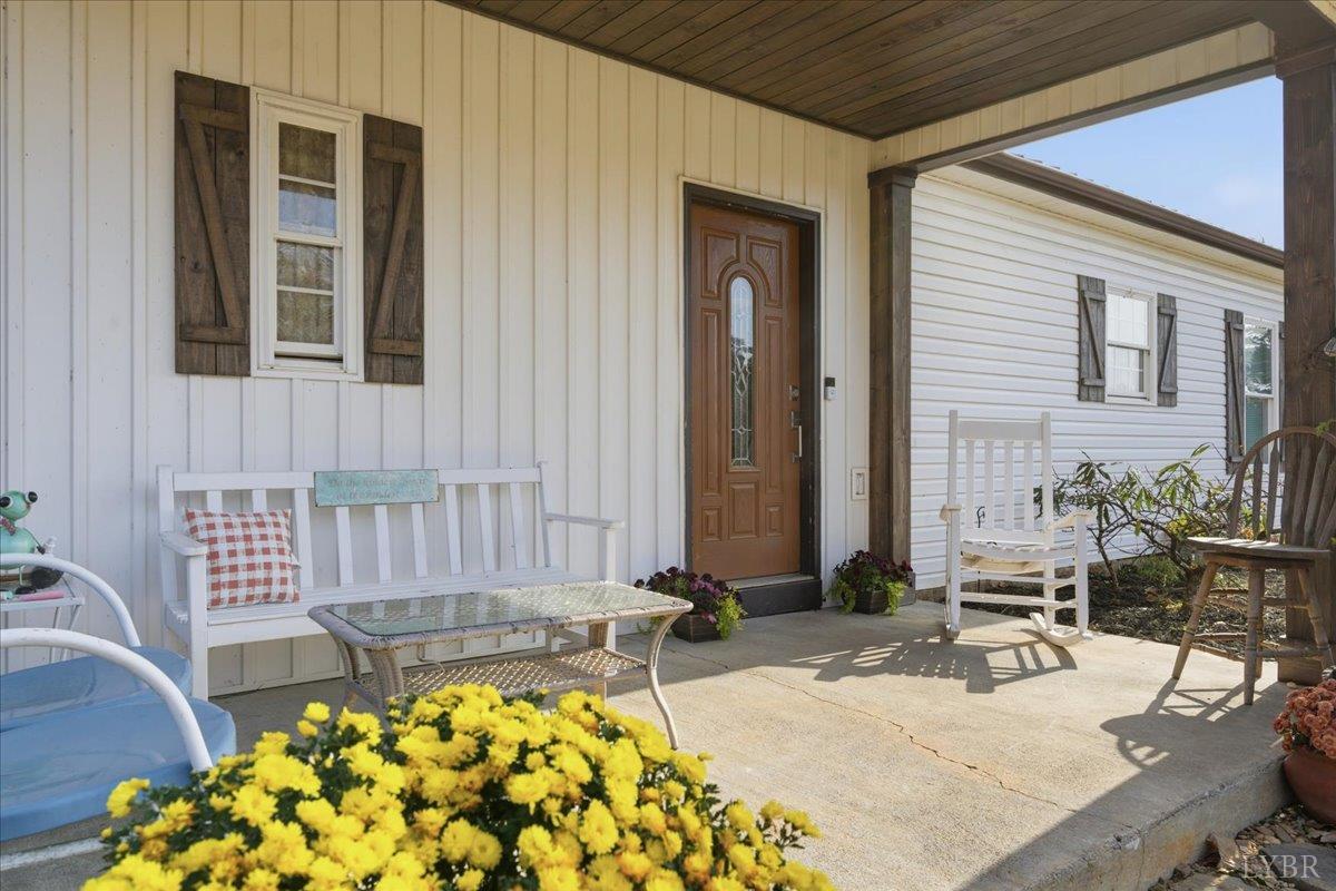 1618 Quaker Church Road Bedford, VA 24523 - Photo 6 of 50 a view of a chair and table in the patio