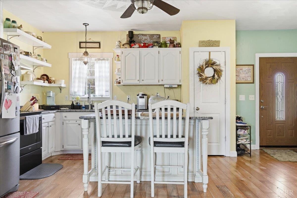 1618 Quaker Church Road Bedford, VA 24523 - Photo 10 of 50 a kitchen with stainless steel appliances cabinets and a table