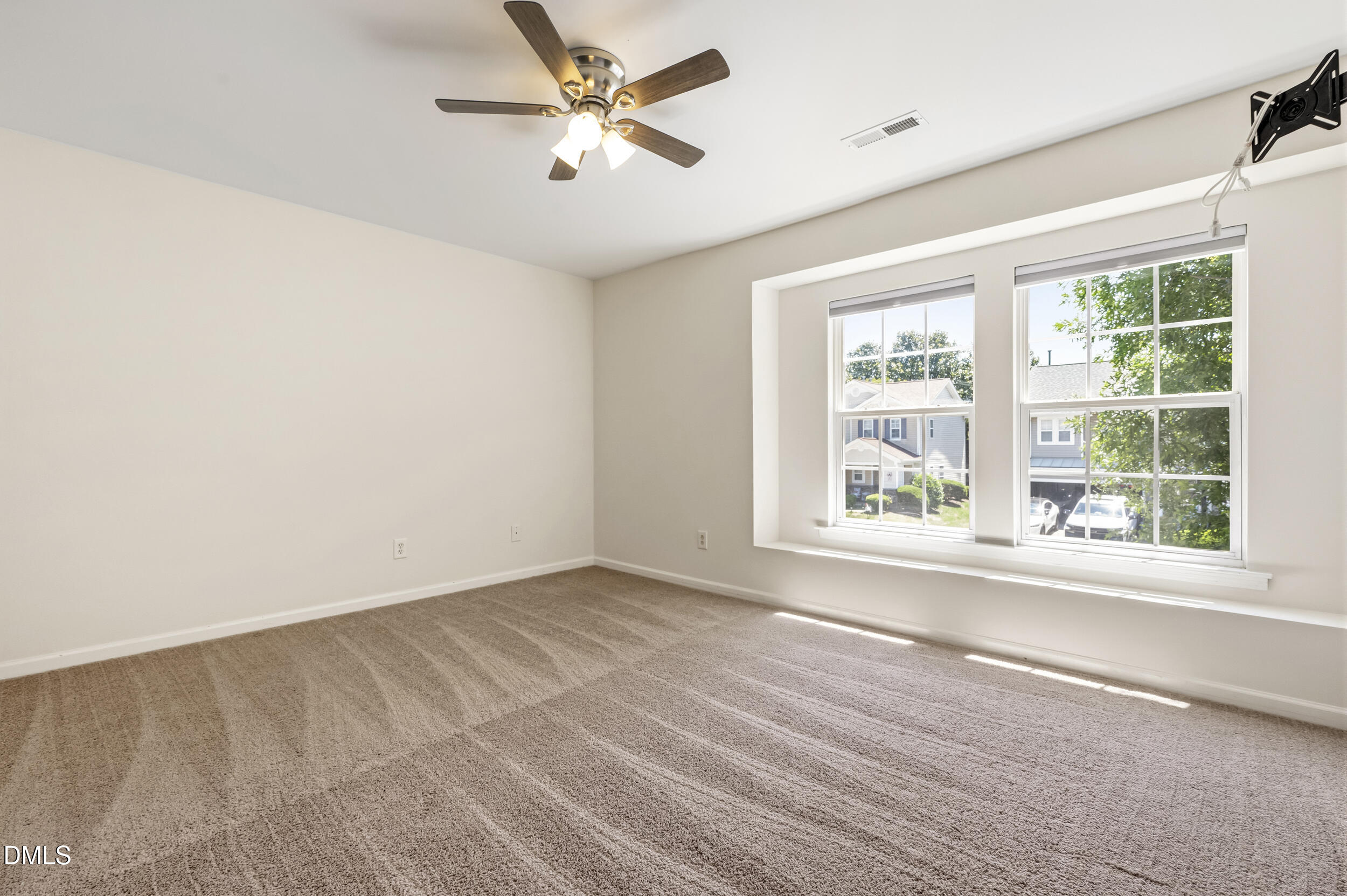 112 Ryder Cup Circle Raleigh, NC 27603 - Photo 20 of 45 a view of empty room with wooden floor and fan