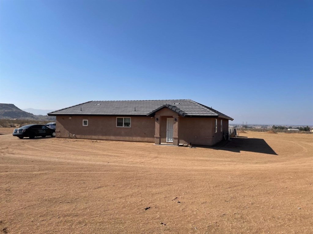 14100 Night Shade Road Apple Valley, CA 92307 - Photo 1 of 1 a view of a house with a yard
