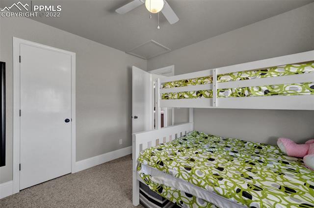 755 Struthers Loop Colorado Springs, CO 80921 - Photo 23 of 37 Bedroom 1 upstairs with a walk-in closet