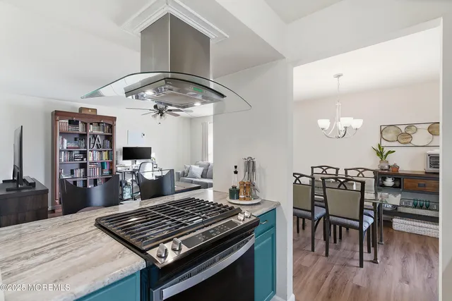 a kitchen with a stove and cabinets