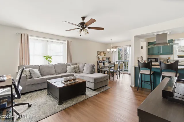 a living room with fireplace furniture and a flat screen tv