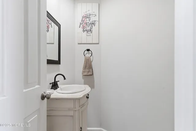 a living room with furniture and a book shelf