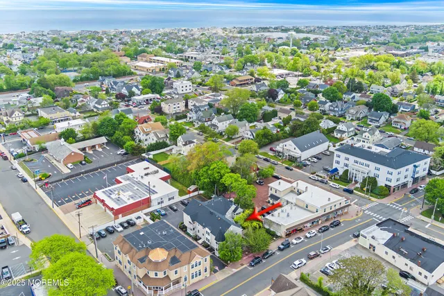 a view of swimming pool with a lawn chairs