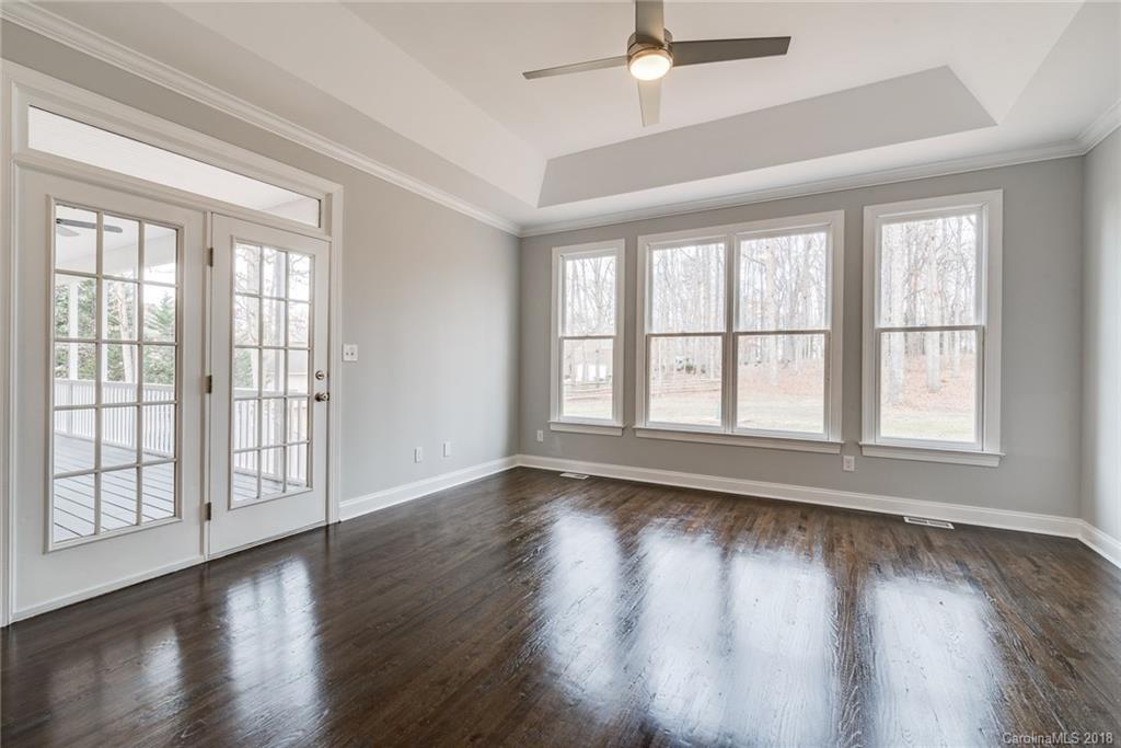 16024 Virginia Lee Court Fort Mill, SC 29708 - Photo 22 of 35 a view of an empty room with wooden floor and a window