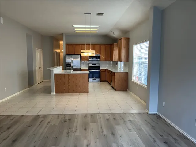 a living room with a couch and a large window