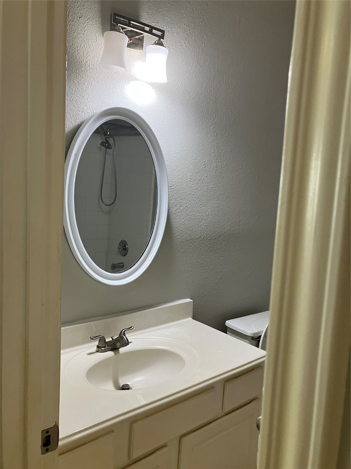 3402 Pebble Beach Lane Pearland, TX 77584 - Photo 24 of 31 a bathroom with a sink and a mirror