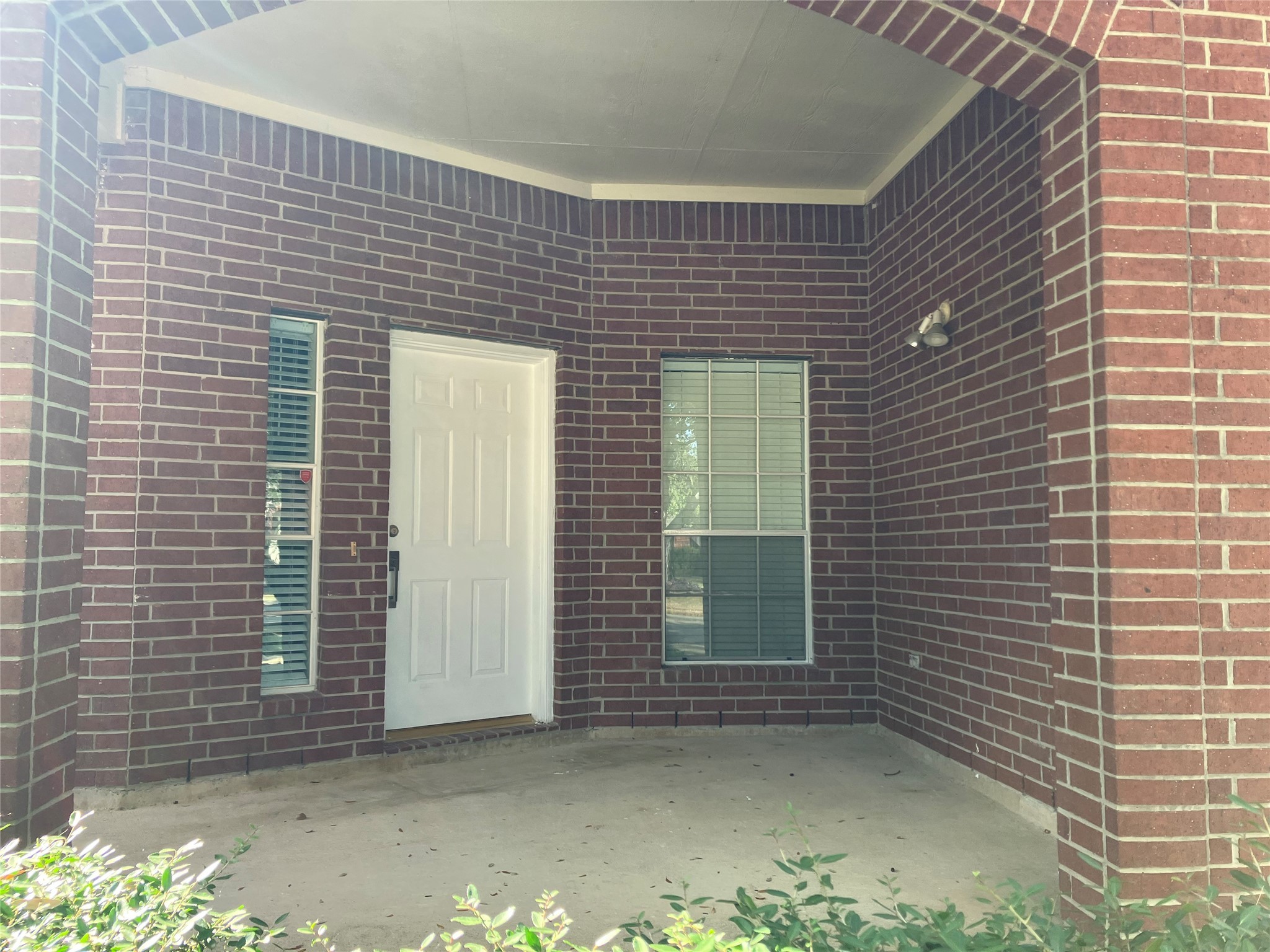 3402 Pebble Beach Lane Pearland, TX 77584 - Photo 3 of 31 a view of a brick house with a window