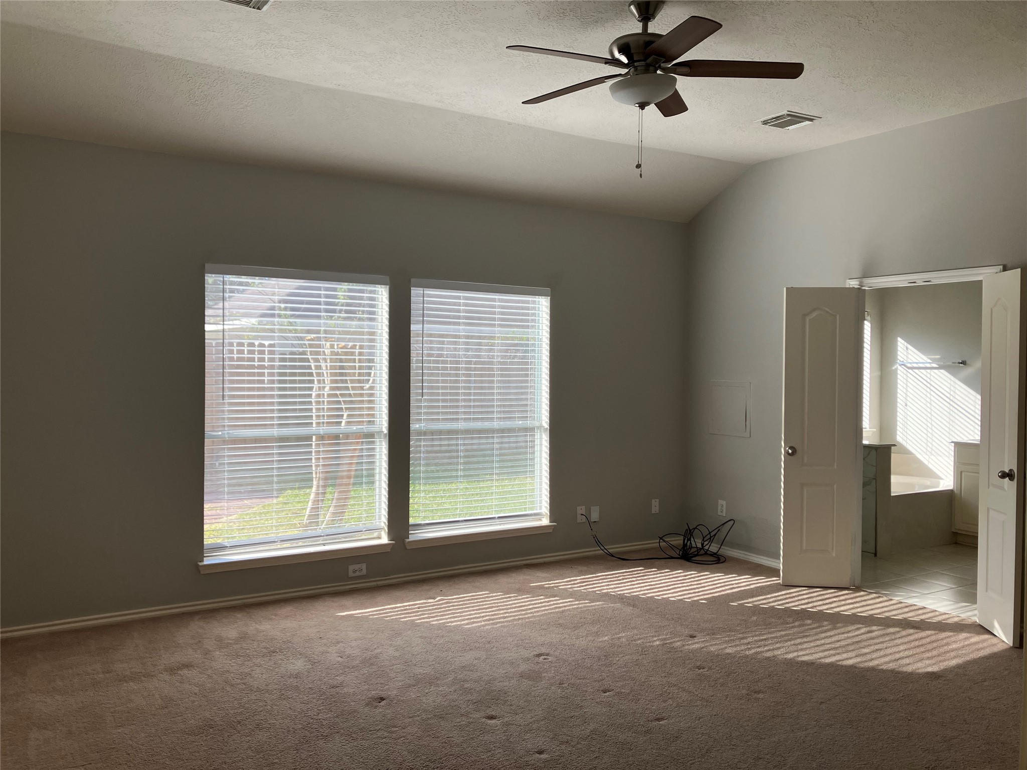 3402 Pebble Beach Lane Pearland, TX 77584 - Photo 4 of 31 a view of a livingroom with a ceiling fan and window