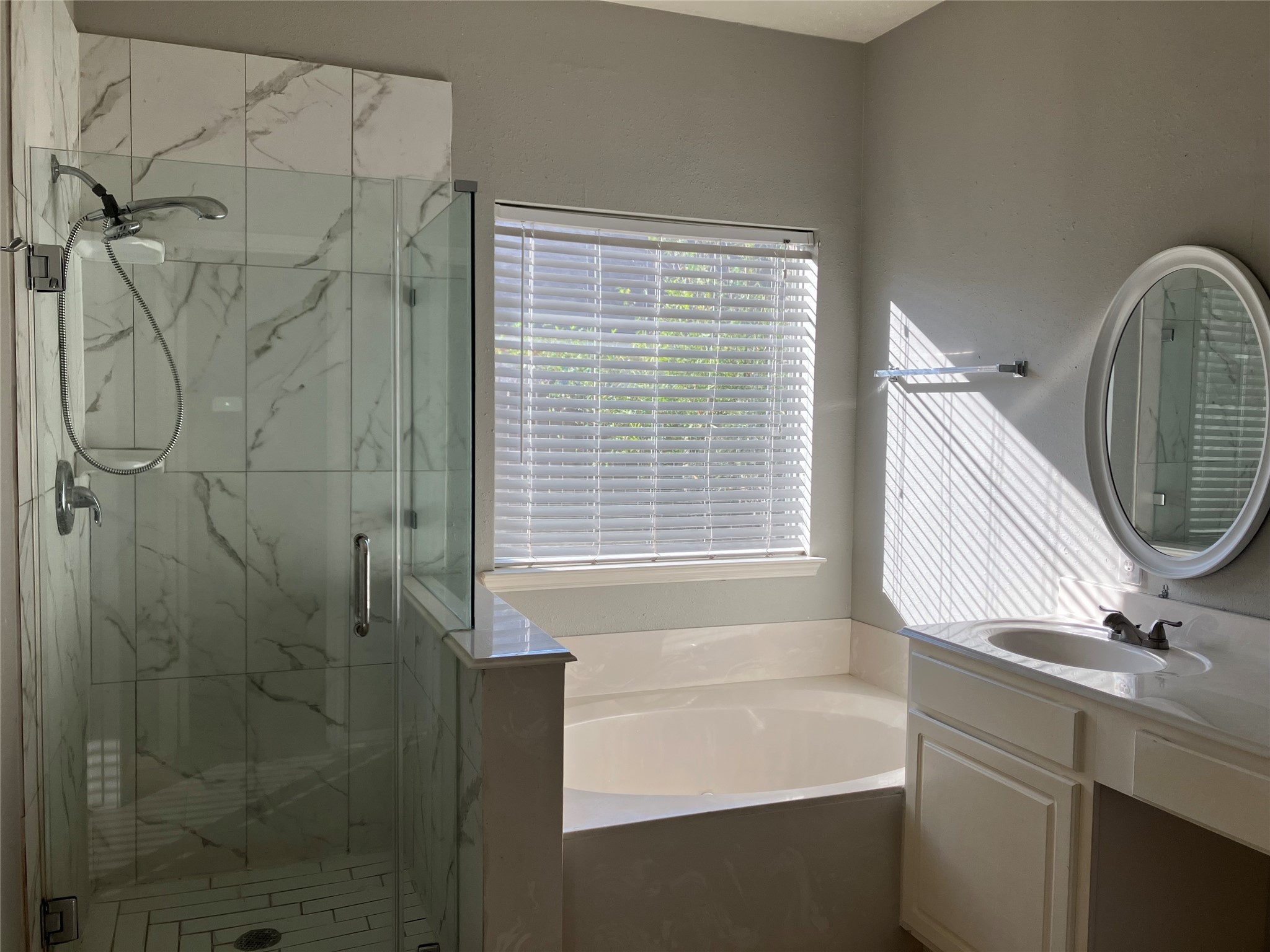 3402 Pebble Beach Lane Pearland, TX 77584 - Photo 7 of 31 a bathroom with a bathtub and shower
