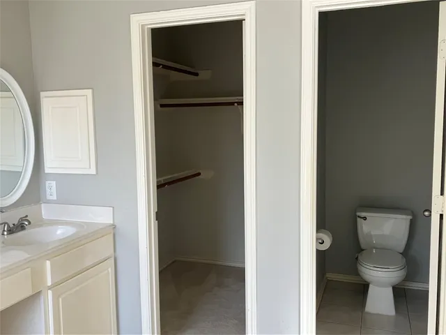 a bathroom with a toilet and a sink