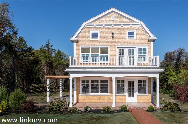 57 Clevelandtown Road Edgartown, MA 02539 - Photo 2 of 34 a front view of a house with a yard