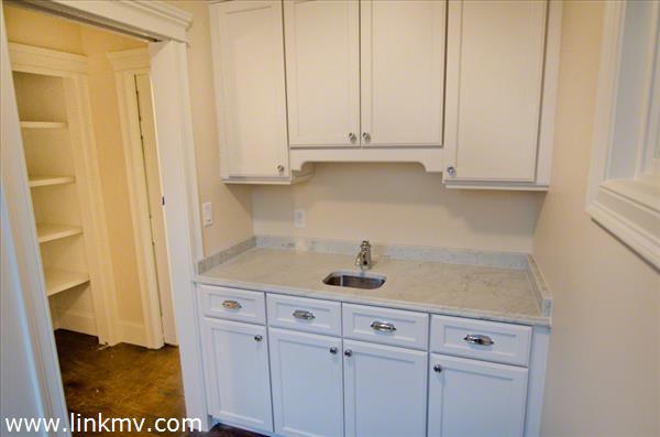 57 Clevelandtown Road Edgartown, MA 02539 - Photo 15 of 34 a kitchen with a sink and cabinets