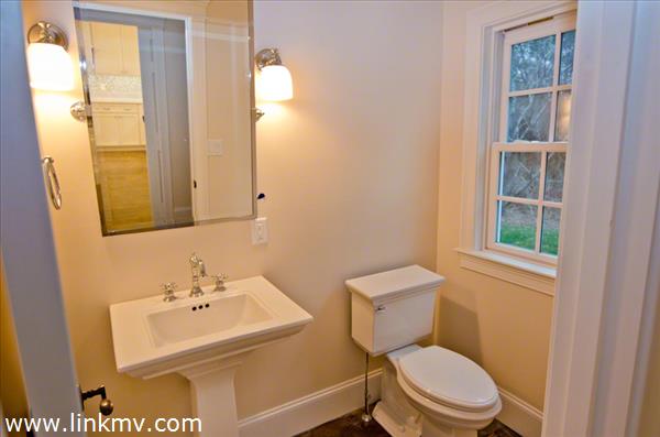 57 Clevelandtown Road Edgartown, MA 02539 - Photo 16 of 34 a bathroom with a sink mirror toilet and next to a window