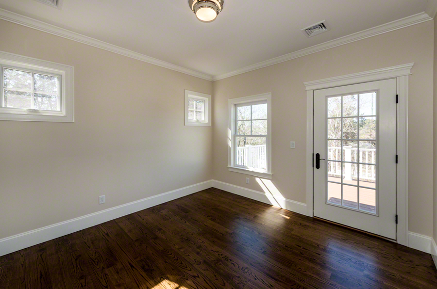 57 Clevelandtown Road Edgartown, MA 02539 - Photo 23 of 34 an empty room with wooden floor and windows