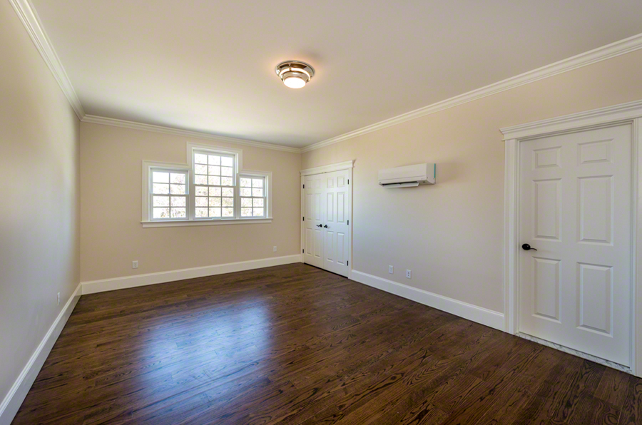 57 Clevelandtown Road Edgartown, MA 02539 - Photo 29 of 34 an empty room with wooden floor and windows