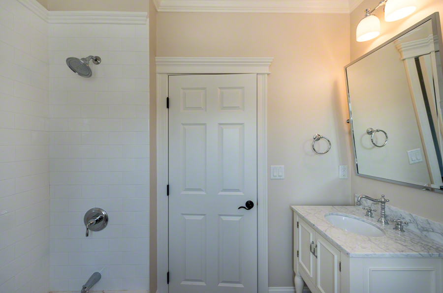 57 Clevelandtown Road Edgartown, MA 02539 - Photo 30 of 34 a bathroom with a granite countertop sink a mirror and shower
