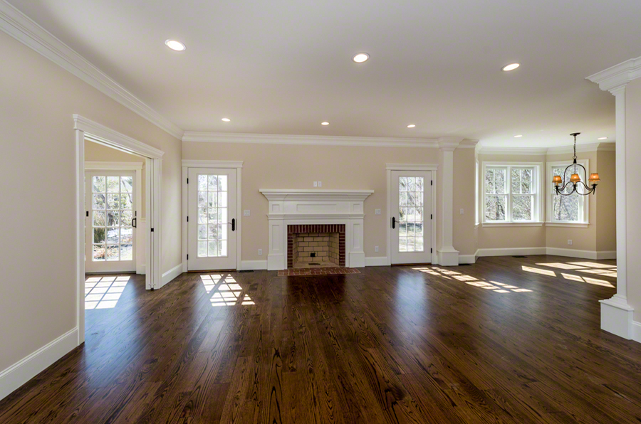 57 Clevelandtown Road Edgartown, MA 02539 - Photo 4 of 34 an empty room with wooden floor and fireplace