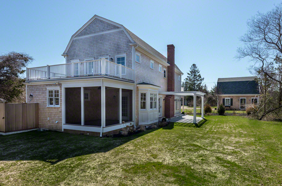 57 Clevelandtown Road Edgartown, MA 02539 - Photo 31 of 34 a view of a house with a yard and plants