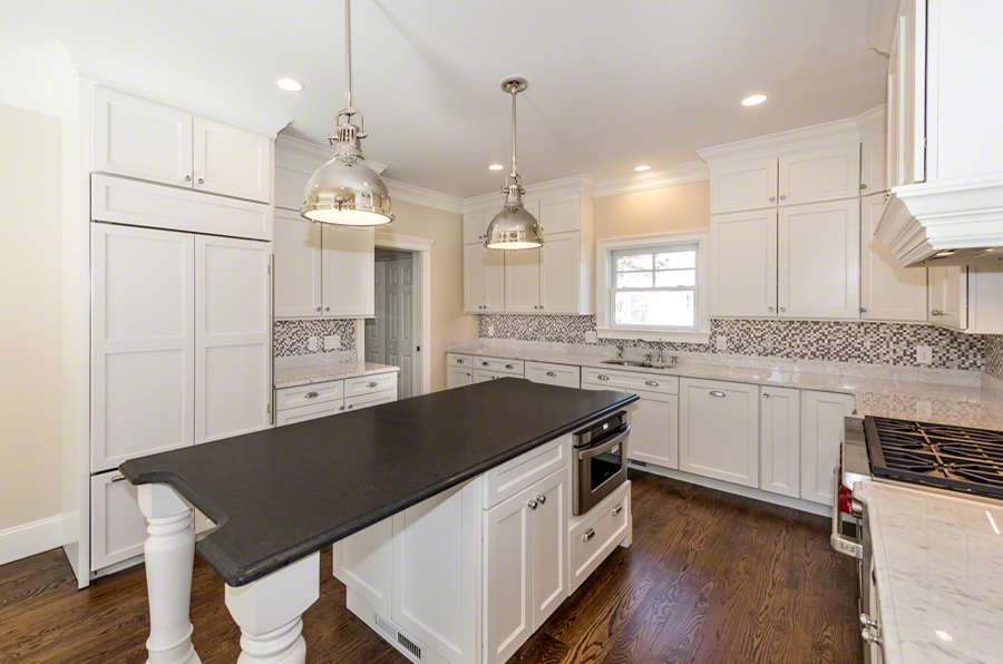 57 Clevelandtown Road Edgartown, MA 02539 - Photo 6 of 34 a kitchen with granite countertop a sink cabinets and wooden floor