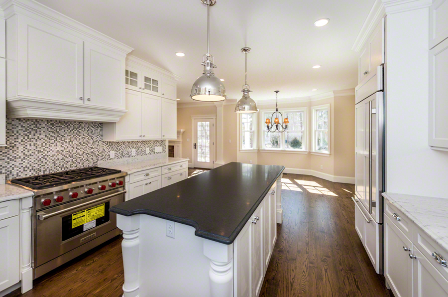 57 Clevelandtown Road Edgartown, MA 02539 - Photo 7 of 34 a kitchen with a stove a sink a counter space and wooden floor