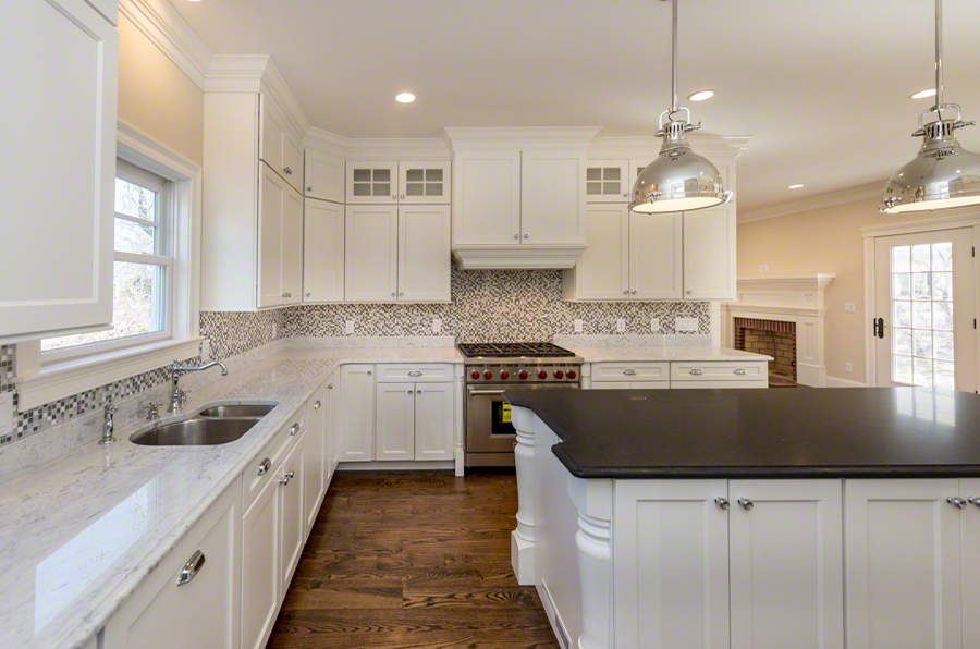 57 Clevelandtown Road Edgartown, MA 02539 - Photo 8 of 34 a kitchen with stainless steel appliances granite countertop a sink a stove and a refrigerator