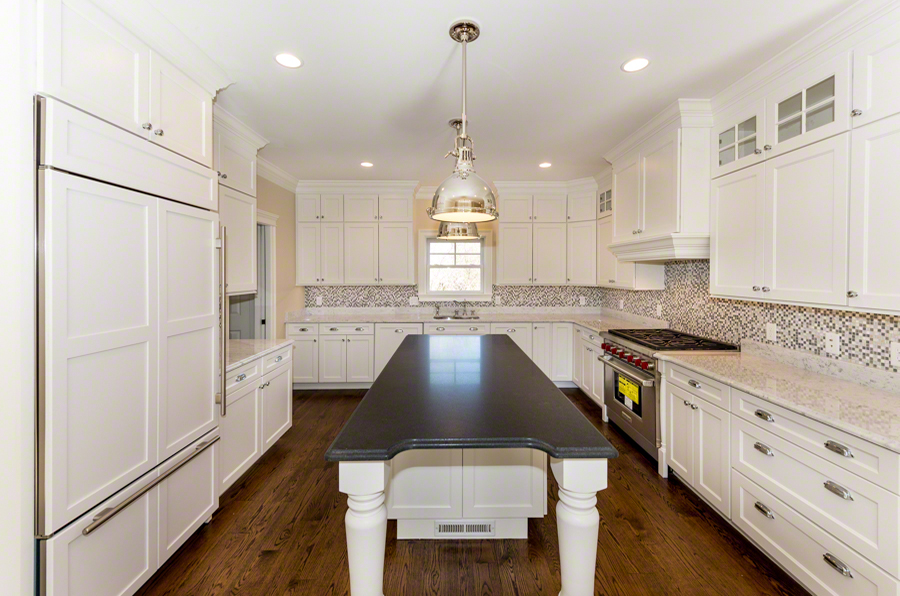 57 Clevelandtown Road Edgartown, MA 02539 - Photo 9 of 34 a kitchen with a refrigerator a sink and cabinets